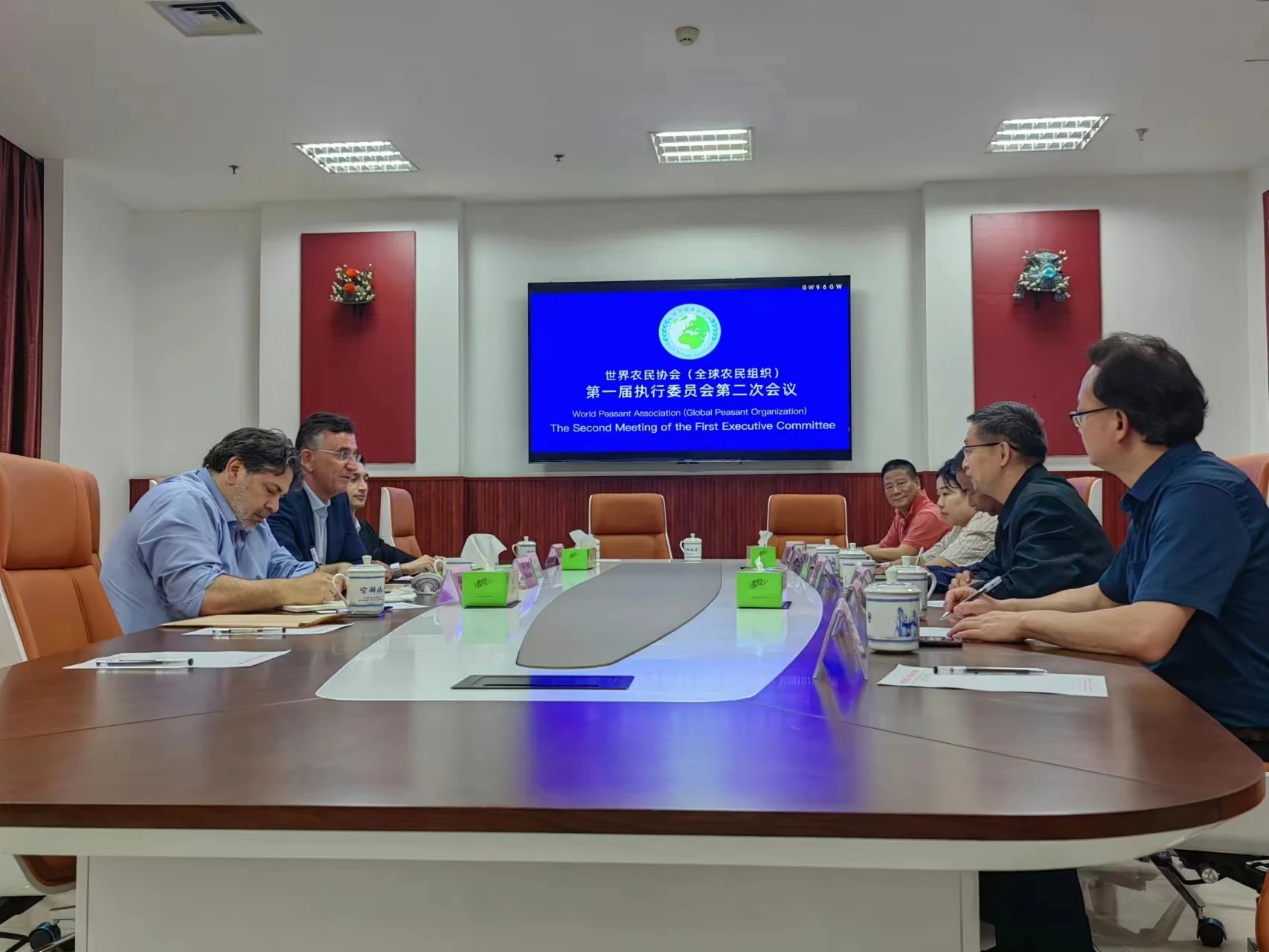 Committee participants seated around the meeting table.