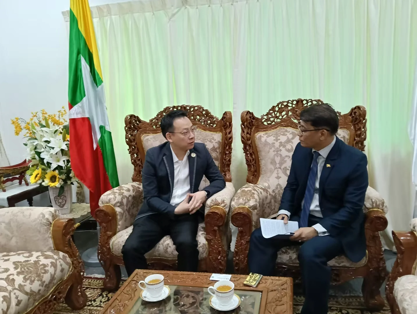 Representatives hold a seated discussion at the Myanmar diplomatic office.