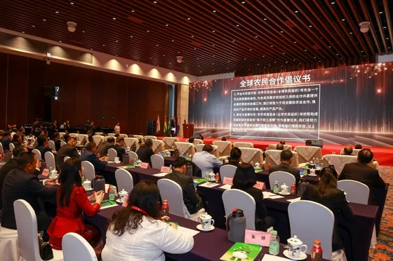 Participants listen during the presentation of the global farmers cooperation initiative.
