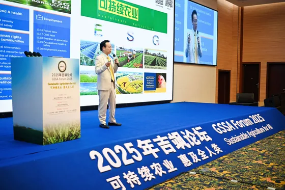 A speaker presents a sustainable-agriculture graphic during the forum.