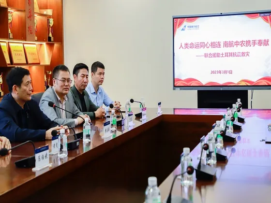 Representatives discuss the relief operation around a conference table.