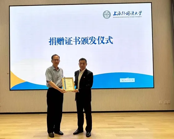 A donation certificate is presented at the SISU ceremony.