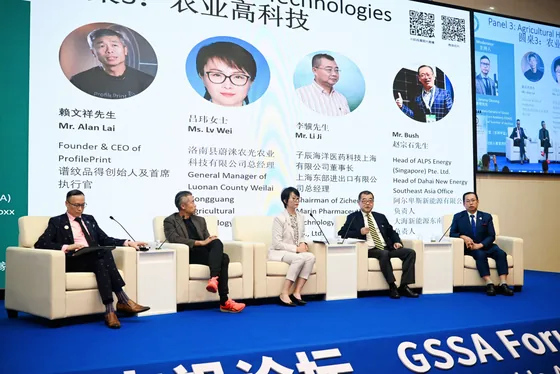 Panelists discuss agricultural technologies on stage.