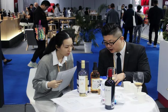 A discussion beside the wine display at the Shanghai expo.