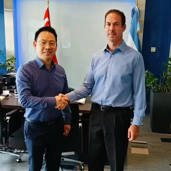 A handshake photograph at the diplomatic meeting, with Singaporean and Argentine flags behind the participants.