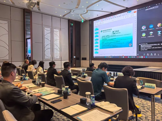 Participants attending a presentation in the Macao conference room.